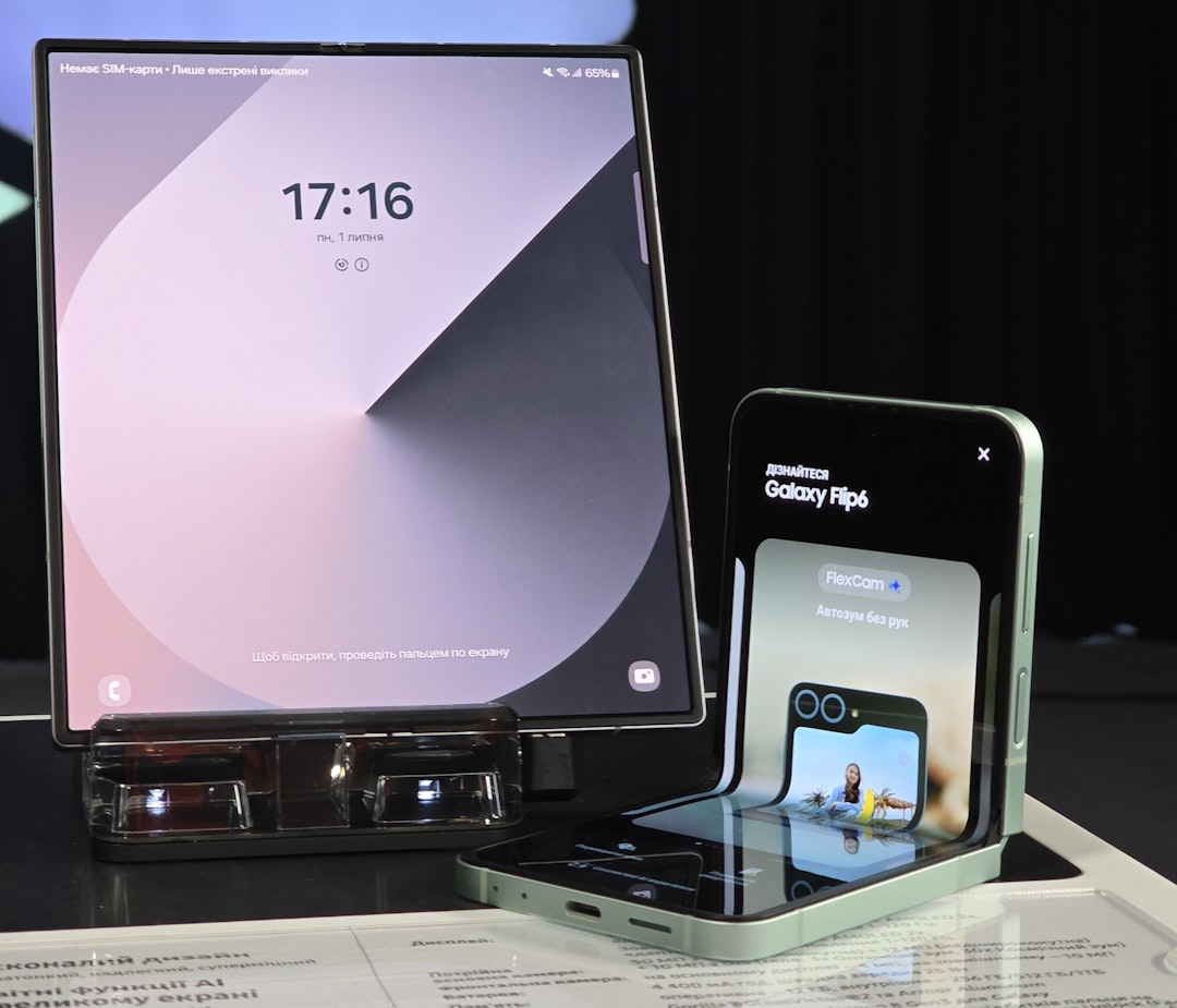 A cell phone and a laptop on a table